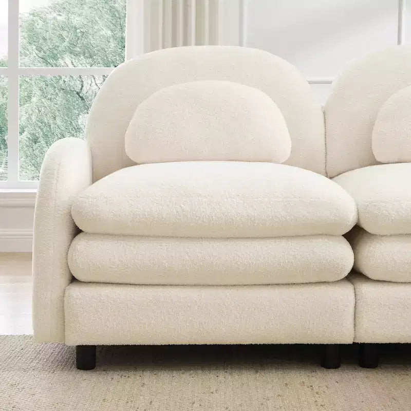 Moderno divano componibile a 2 posti rivestito in tessuto Teddy con cuscini lombari e pouf | Beige / Cammello / Verde / Arancione