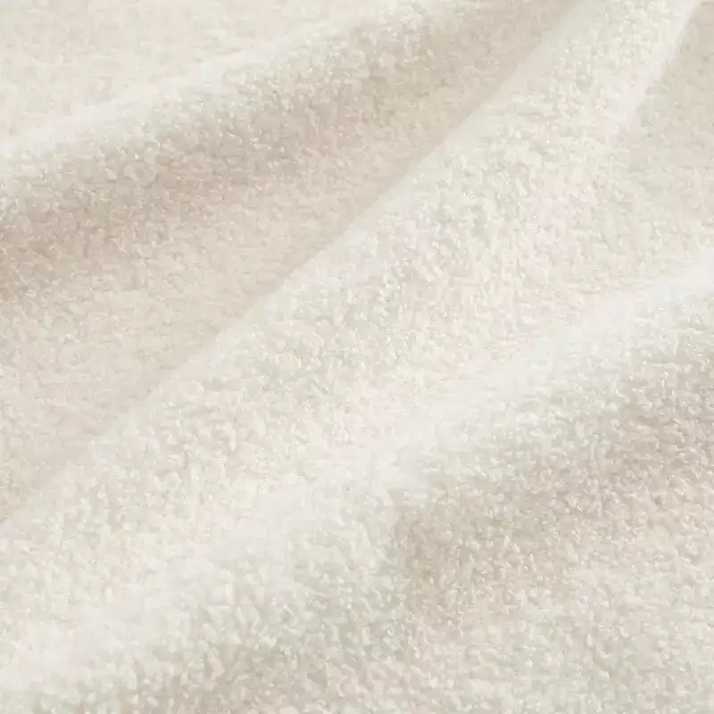 Moderno divano componibile a 2 posti rivestito in tessuto Teddy con cuscini lombari e pouf | Beige / Cammello / Verde / Arancione